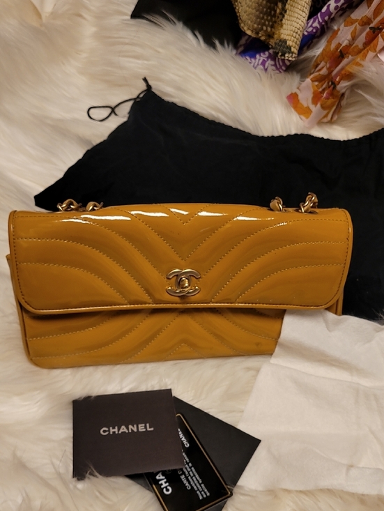 CHANEL Handbags - CHANEL Patent Chevron Quilted Shoulder Bag in Mustard